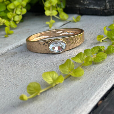 Gold hammered cuff with clear crystal stone